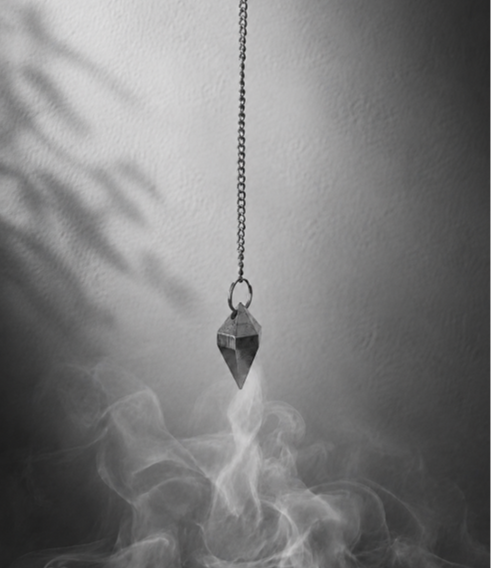 Close-up of a pendulum used for spiritual guidance